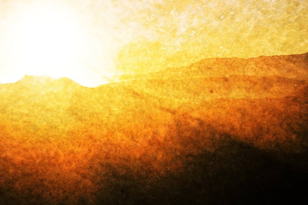 textured bright sun over the mountains